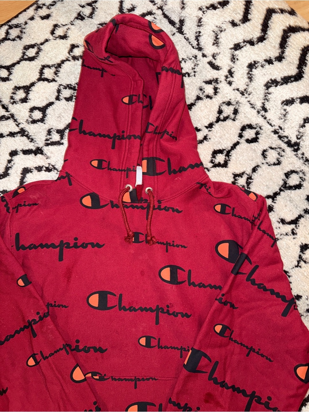 Champion Red Pullover Hoodie with Black and Orange Logo Print